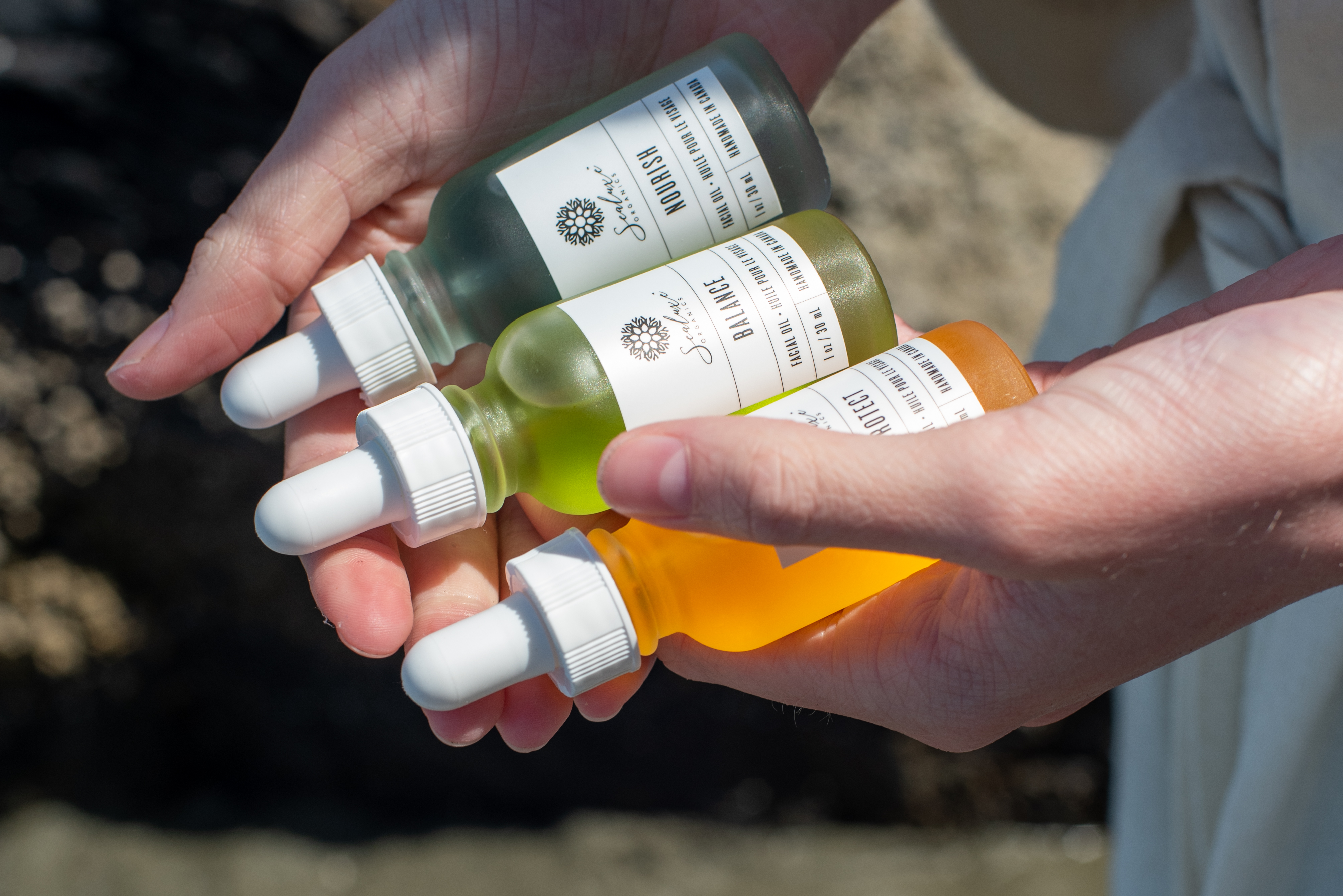 A hand holding a bowl with a facial mask mix in in