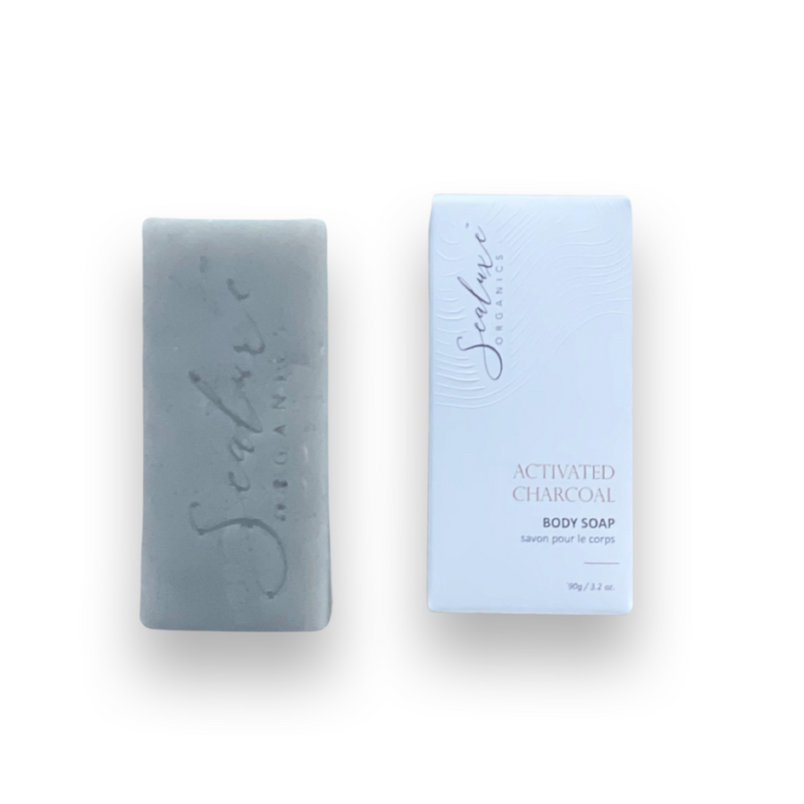 Photo of Activated Charcoal Soap Bar on a white background. The soap bar is rectangular in shape, with a cement grey color and a textured surface.