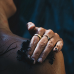 Using Sealuxe's seaweed and coffee scrub in shower on shoulder and neck.