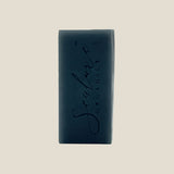 Black soap bar with 'Sculpt' branding on a white background