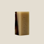 Bar of soap with branding on a white background