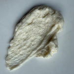 Clump of white cream on a white background