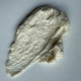Clump of white cream on a white background