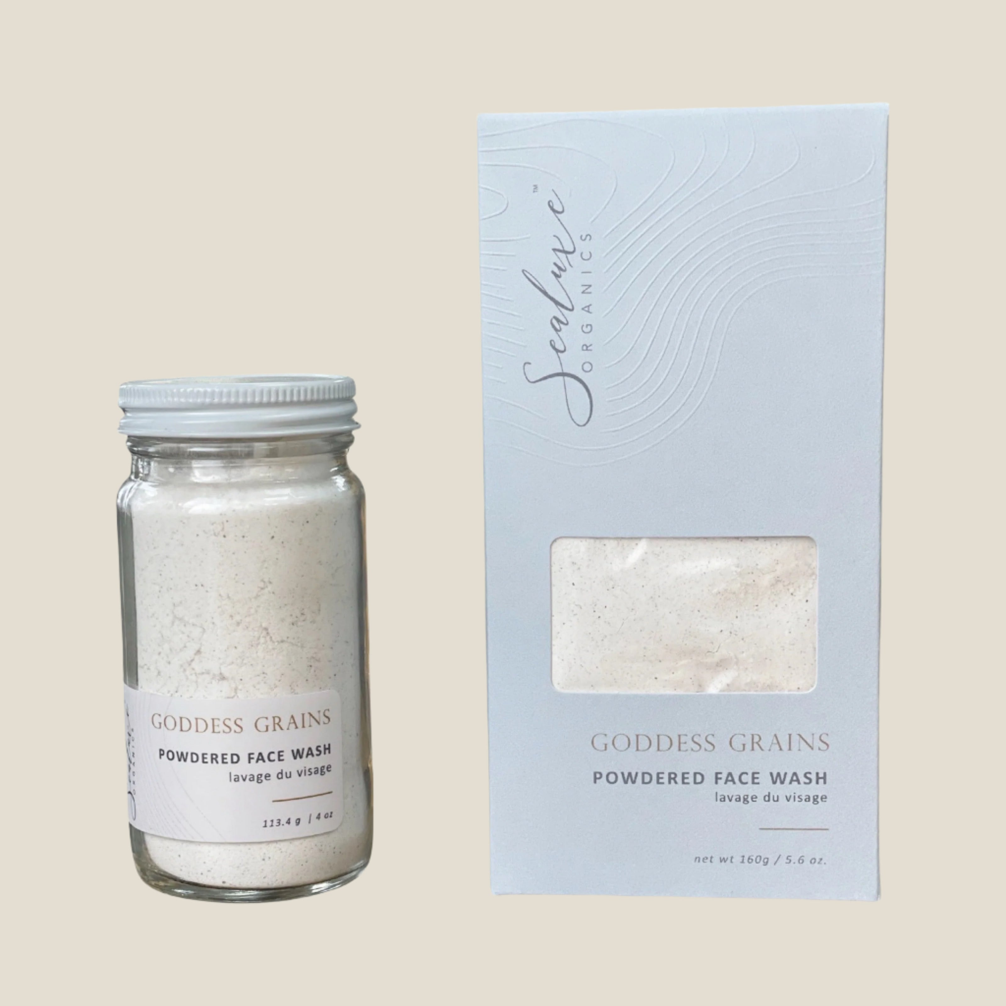 A glass jar and a box packaging for Goddess Grains Facial Polish. The jar is transparent with the product inside, and the box is light blue with product details.