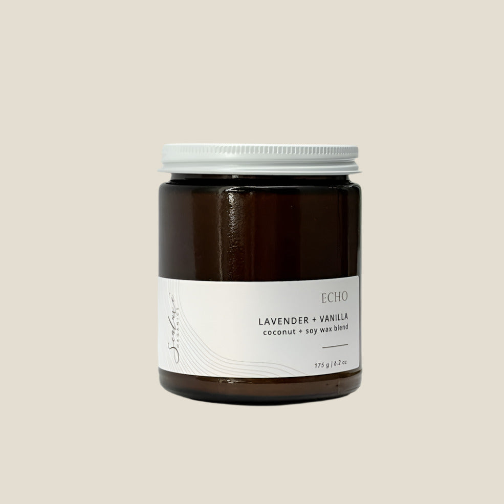 Jar of candle with 'Echo' label on a white background