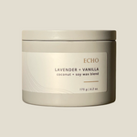 Echo candle in grey tin with white label, with the words lavender and vanilla and coconut + soy wax blend