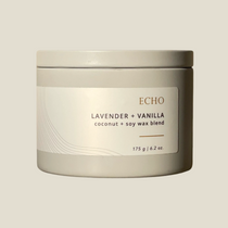 Echo candle in grey tin with white label, with the words lavender and vanilla and coconut + soy wax blend