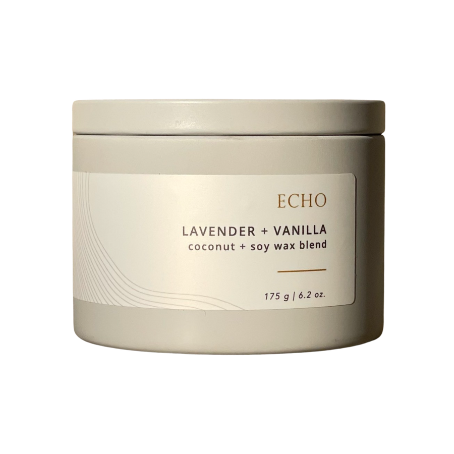 Echo candle in grey tin with white label, with the words lavender and vanilla and coconut + soy wax blend