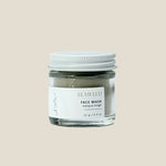 Jar of seaweed face mask with a white lid on a light gray background