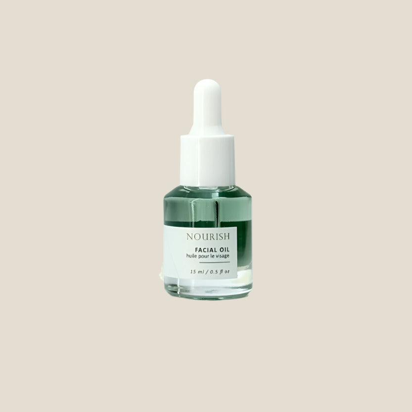 Facial oil dropper bottle labeled 'Nourish' on a light gray background