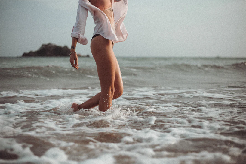 Walking barefoot in the ocean for thalassotherapy