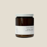 Candle jar labeled 'Kelp Forest' with vetiver and cedar on a white background