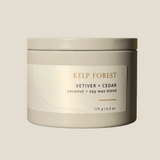 A grey tin with a label that reads Kelp Forest, vetiver and cedar made with coconut and saoy wax blend