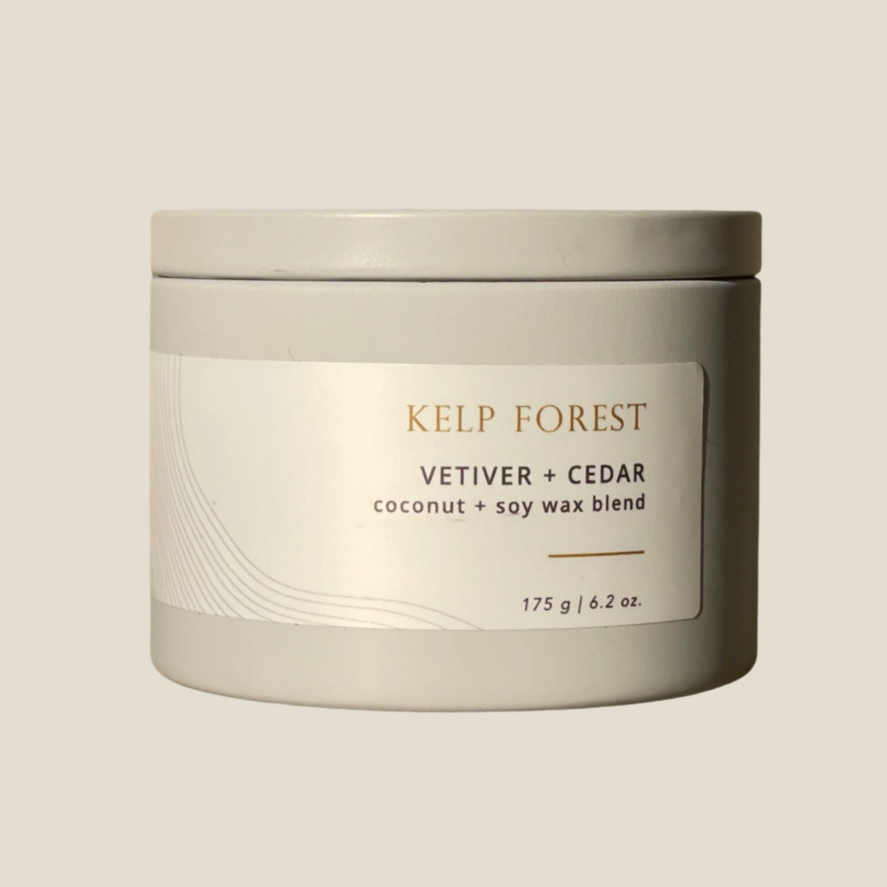 A grey tin with a label that reads Kelp Forest, vetiver and cedar made with coconut and saoy wax blend