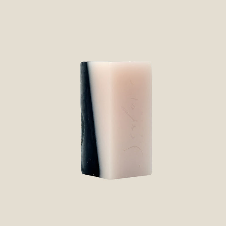 Rectangular bar of soap with gradient color on a white background
