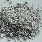 Gray powdery substance on a light gray background