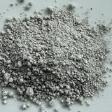 Gray powdery substance on a light gray background