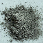 Gray powder on a light blue background