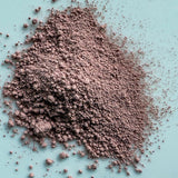 Pink powder on a light blue background