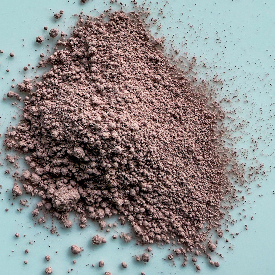 Pink powder on a light blue background