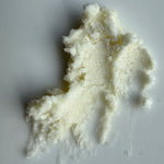 Clump of white cream on a white background