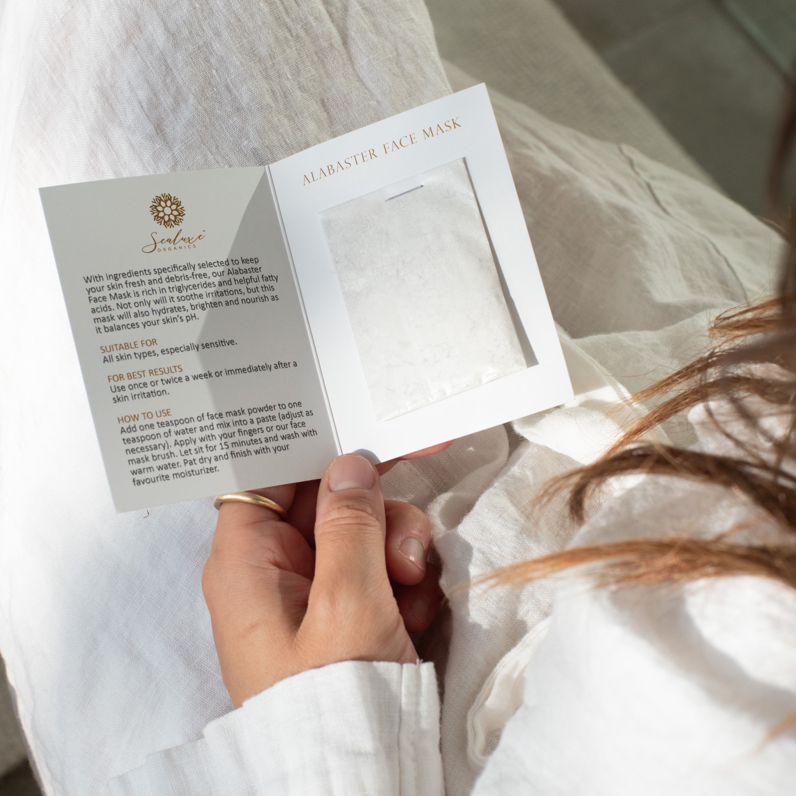 Sealuxe Alabaster facial mask applied to face