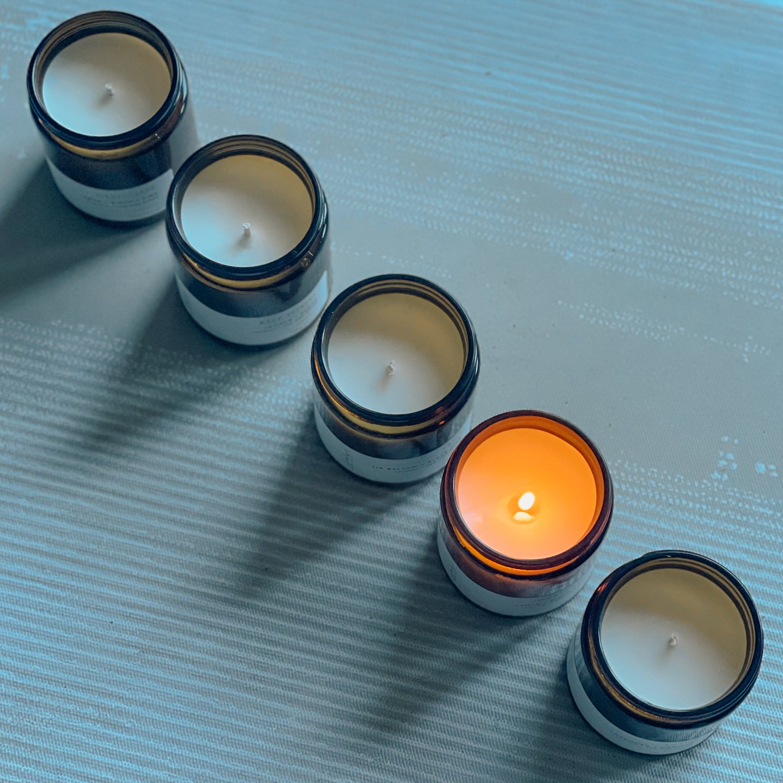 Sealuxe Kelp Forest amber glass candle burning