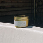 Sealuxe Anchor candle resting on the edge of a bathtub