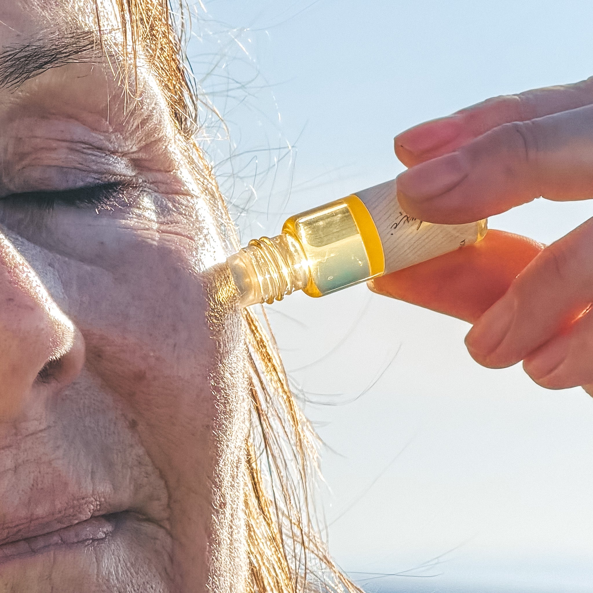 Applying moisturizer to skin