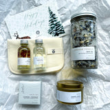 Sealuxe Bath Gift Box flat lay with Lavender Vanilla Bath Tea, Gold Candle, Bath Bomb, Cloth, Mini Bubble Bath, and Mini Body Oil, perfectly arranged for a luxurious at-home spa experience.