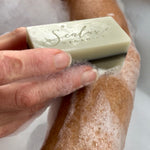 Sealuxe Coastal Breeze soap bar being used on an arm