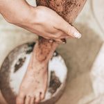 Sealuxe coffee body scrub being applied to a leg