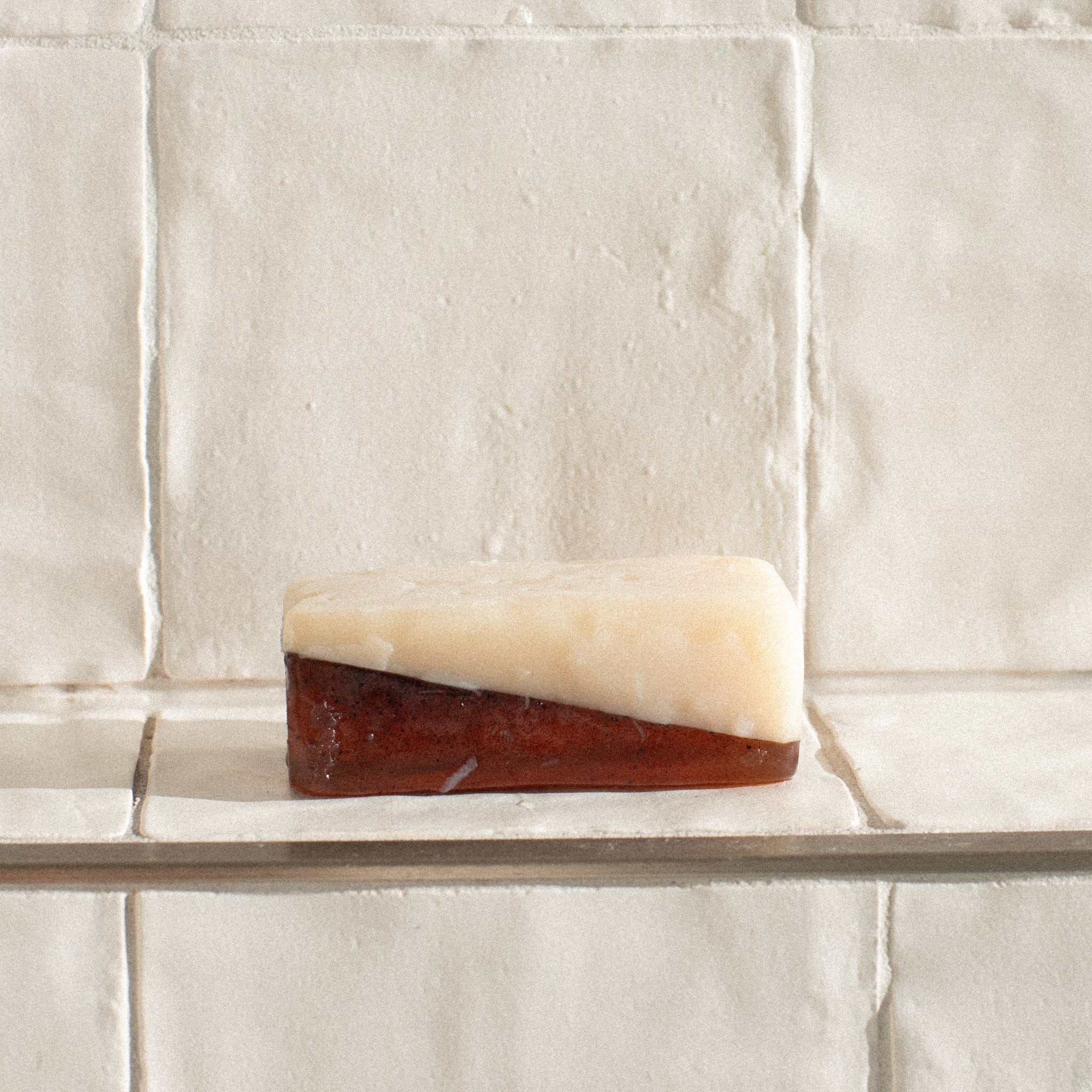 Dark brown espresso coffee soap bar on a white surface — Sealuxe natural handcrafted soap