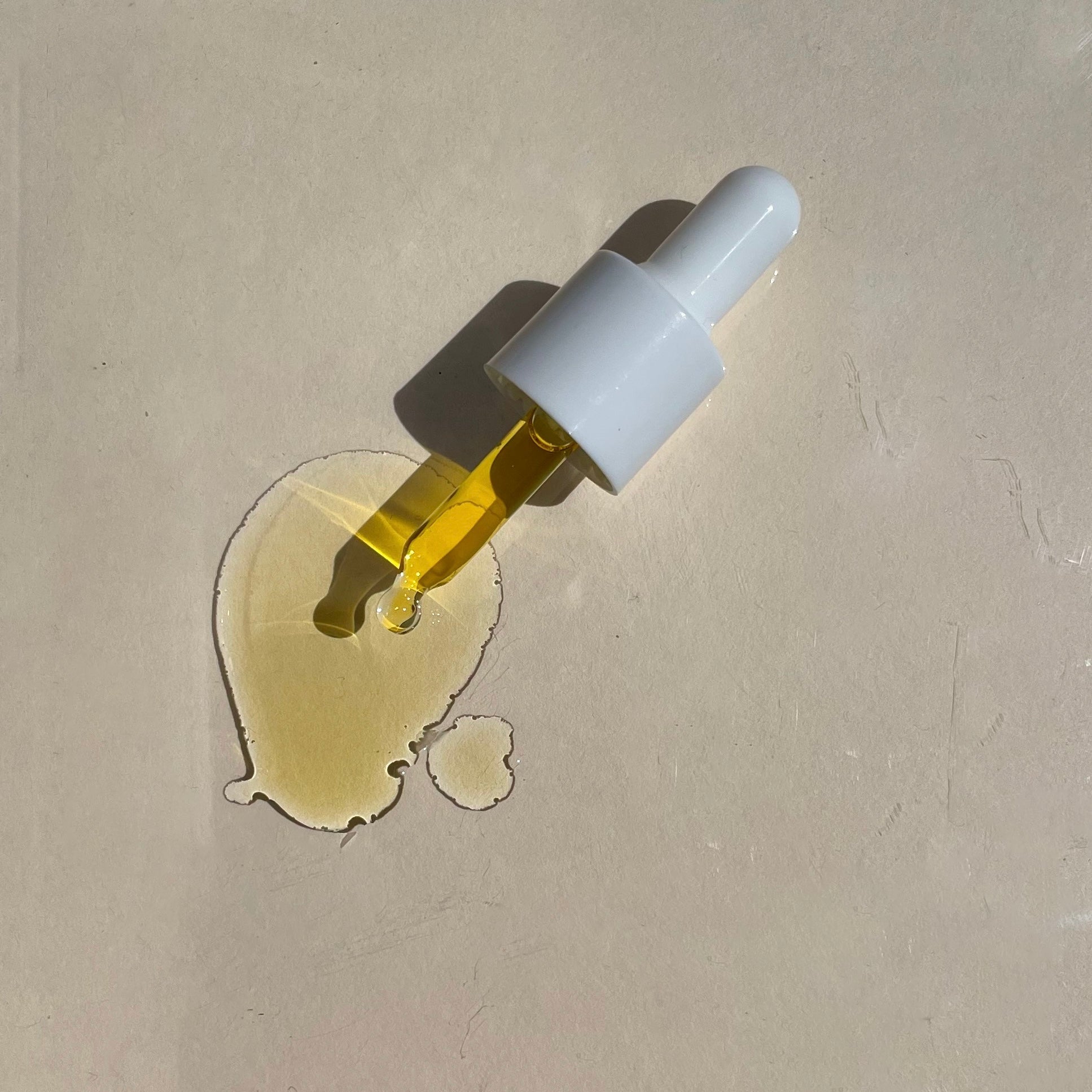 Close-up texture of Sealuxe facial oil on skin
