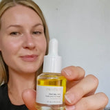 Sealuxe facial oil bottle on a clean white background