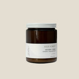 Sealuxe Kelp Forest candle in a natural outdoor setting