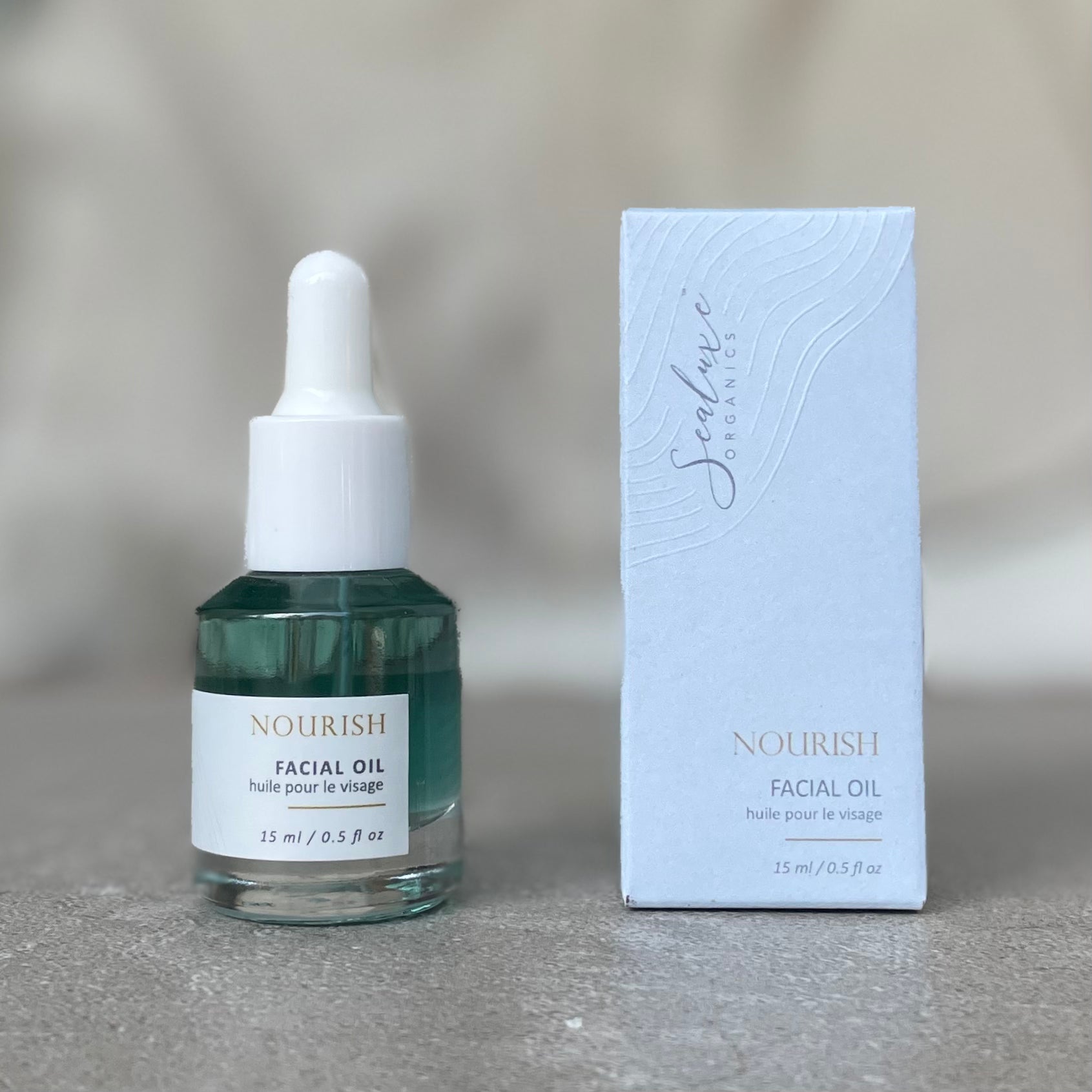 Sealuxe Nourish facial oil bottle with its gift box