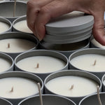 Placing lids on freshly made Sealuxe candles