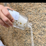 Pouring Sealuxe Lemon bath salts into a bath