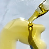 Close-up texture of Sealuxe Protect facial oil on skin
