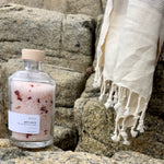 Sealuxe Rose bath product displayed with a towel