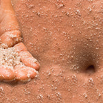 Sealuxe Rose body scrub applied to the belly
