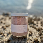 Sealuxe Rose scrub displayed on barnacle-covered rocks