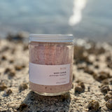 Sealuxe Rose scrub displayed on barnacle-covered rocks
