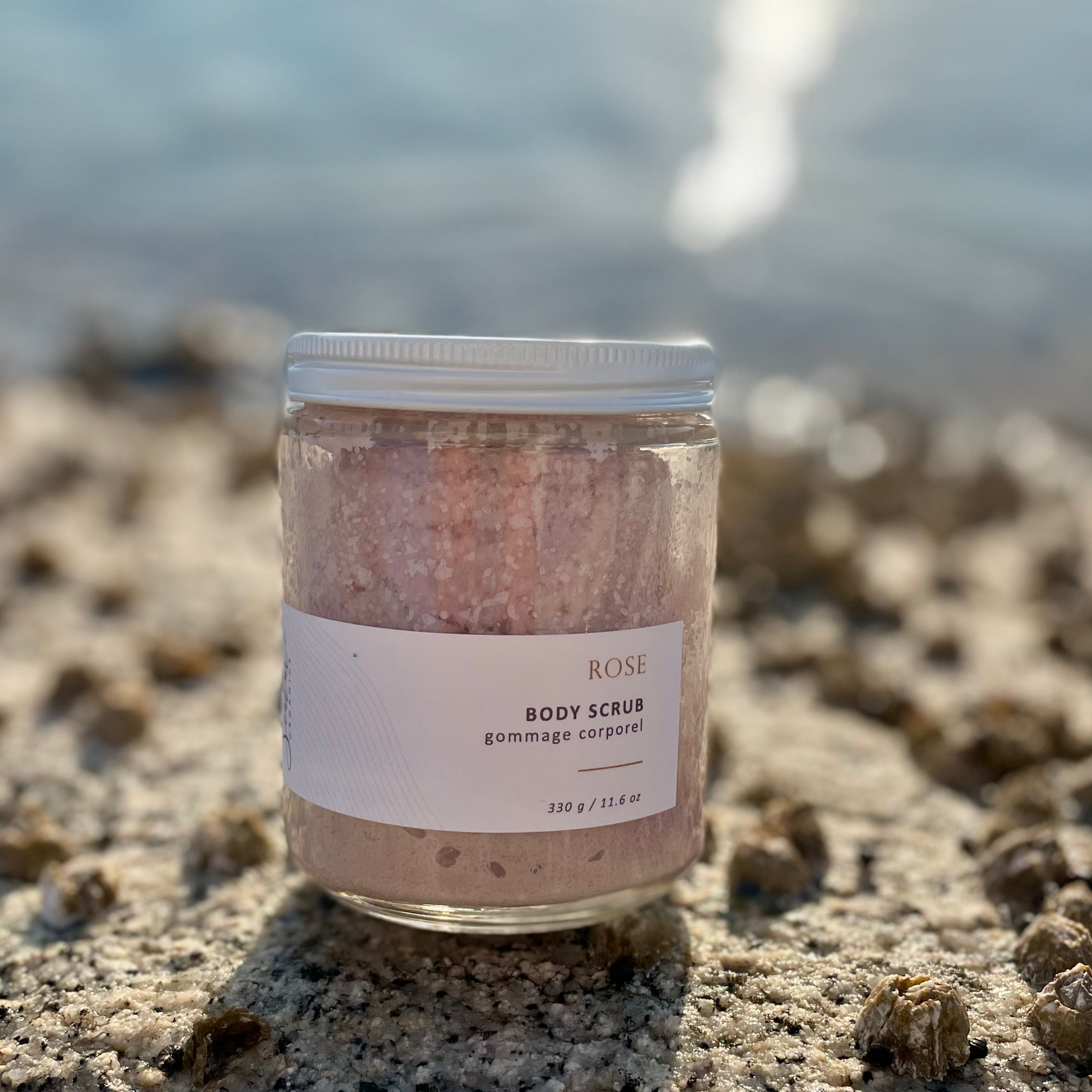 Sealuxe Rose scrub displayed on barnacle-covered rocks