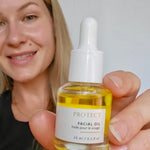 Smiling person with glowing skin after using Sealuxe facial oil