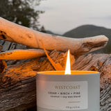 Sealuxe West Coast candle burning in an outdoor setting