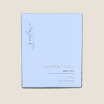 A rectangular box of Sealuxe Lavender Vanilla Bath Tea. The box is a very pale lavender-blue with black script branding and black text, including 'LAVENDER VANILLA BATH TEA' and 'net wt 76 g / 2.