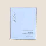 A square white box of Sealuxe Organics Lemon Lavender Bath Tea. The box features elegant black cursive branding and gold text indicating the product name and type.