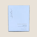 A square white box of Sealuxe Organics Ocean Goddess Bath Tea. The box features elegant black cursive branding and gold and black text indicating it is a 76 g / 2.